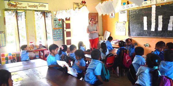 Job-Embedded Learning for Teachers, Coaches, and Leaders - Laurie teaching young students
