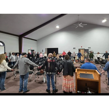 Prayer circle at Vision of Hope Church in Woodstock