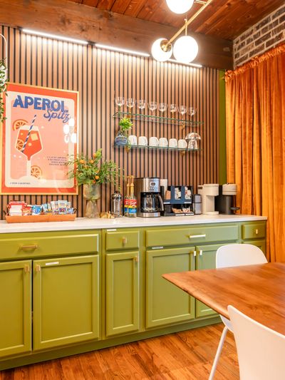 Bright kitchen corner with green cabinets 