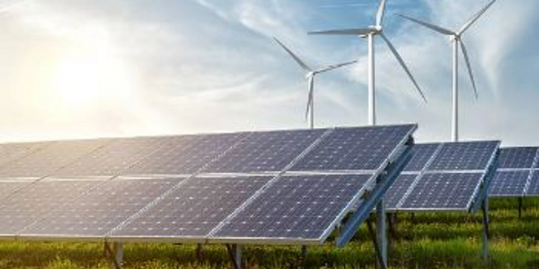 Solar panels and wind turbines harness renewable energy together in a sunny field.
