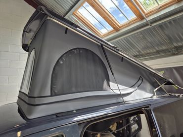 Ford Transit Custom Skyline pop top raised, showing the scenic canvas