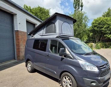 Ford Transit Custom with Skyline pop top raised, finished by Sharkbite Conversions