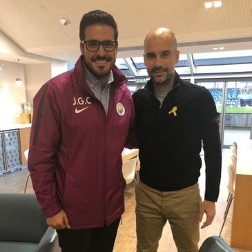 Professional soccer coach Joan Ginebra learning from Pep Guardiola during a high-level conversation