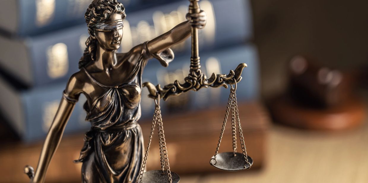 Image of lady justice holding the scales of justice