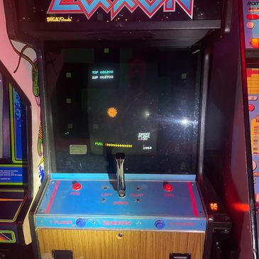 Vintage arcade game machine with joystick and buttons.