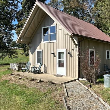 Vertical fresh siding on guest house 