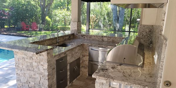 Worked around the pilar to create a U shaped outdoor kitchen