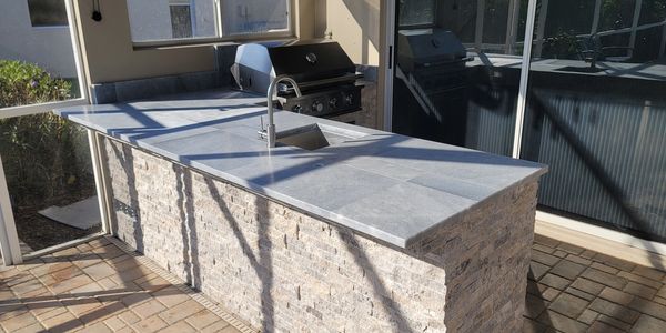 Pavers used as the countertop with natural stone siding
