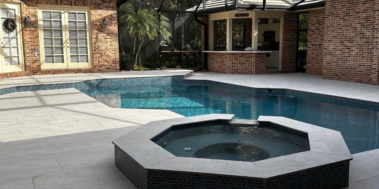 A custom pool construction with a spa