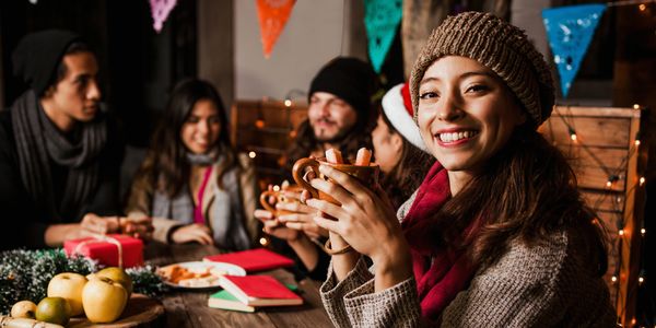 Group of people smiling and eating