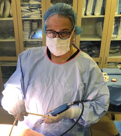 Photo of Dr. Sorokin doing liposuction