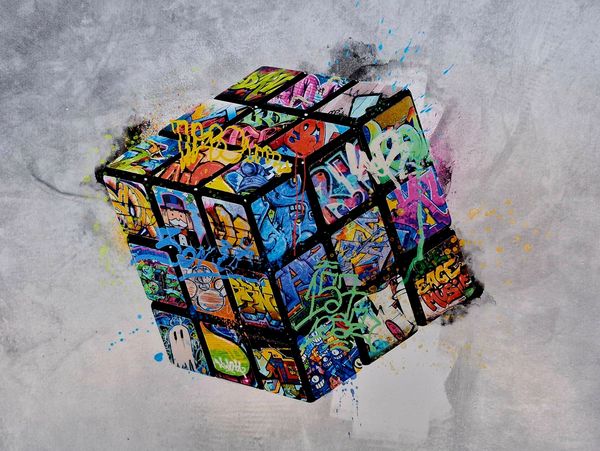 Colorful graffiti art on a Rubik's cube.