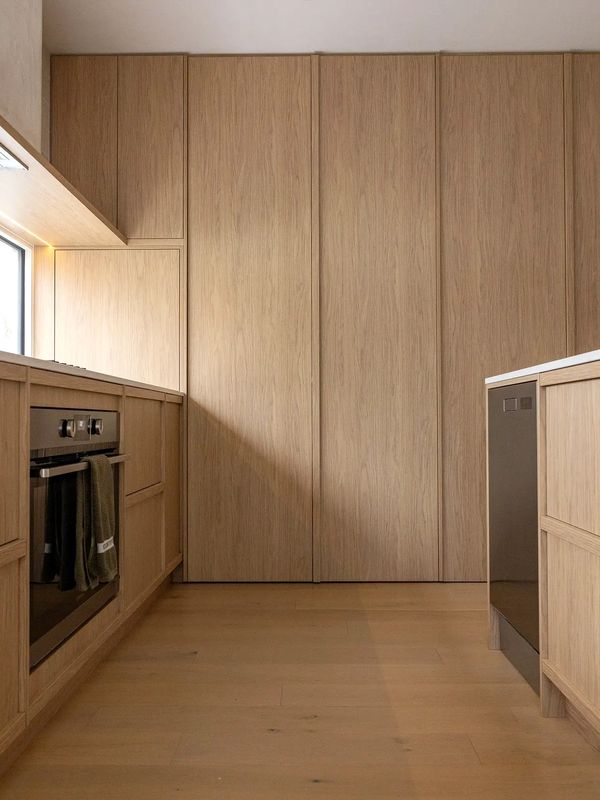 Minimalist kitchen with light wood cabinets and modern appliances. Follow us on instagram for social media updates 