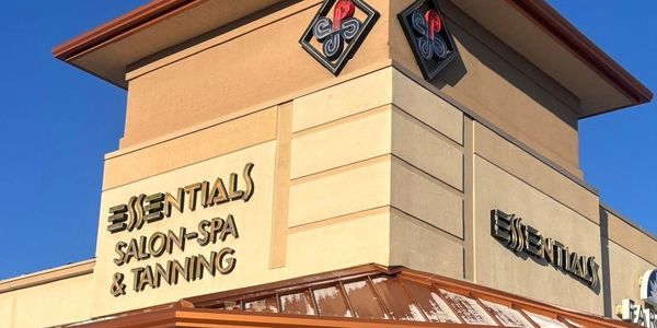 Corner view of Essentials Salon-Spa &amp; Tanning building.
