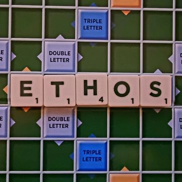 Scrable board displays the word "ethos". Section describes Sober Socials ethos to sober events UK.