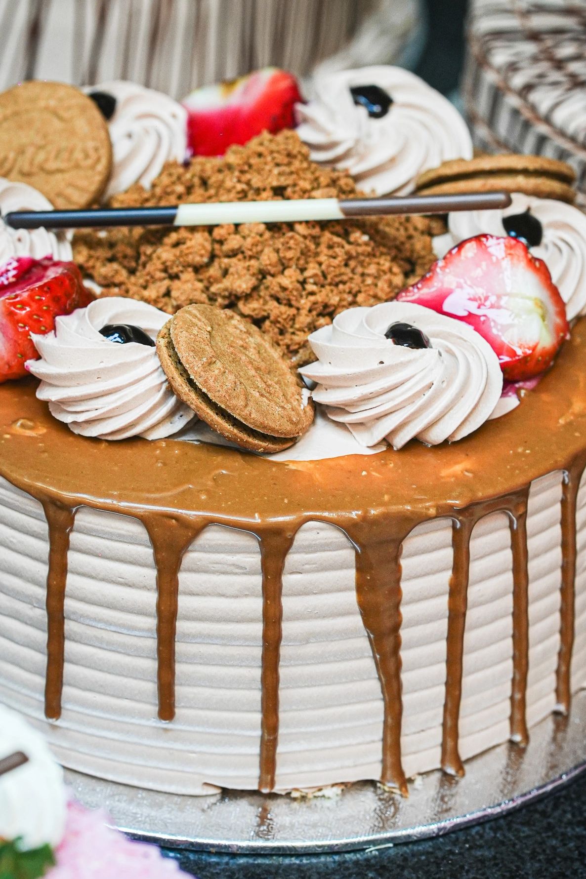 Hand-decorated caramel celebration cake from Village Market bakery, Liverpool