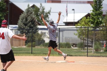 Man celebrating on a baseball field.