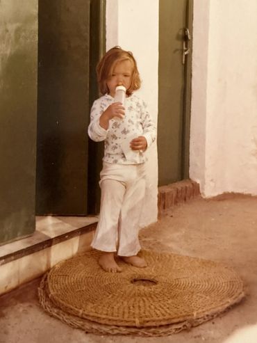 Mercedes standing on top of an olive pressing mat in the patio of Cortijo Coracho. 