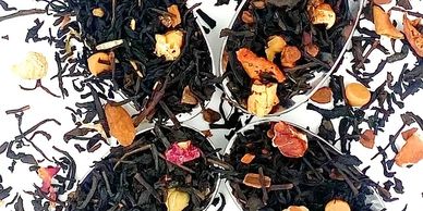 Close-up of tea leaves with various dried fruits and nuts.