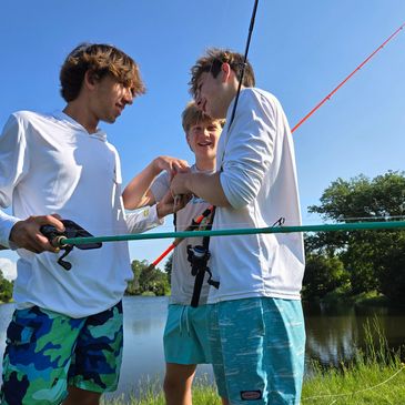 BananaBobb with fishing poles and Pro-staffers Gianni and Gavin in City Park, New Orleans, Louisiana