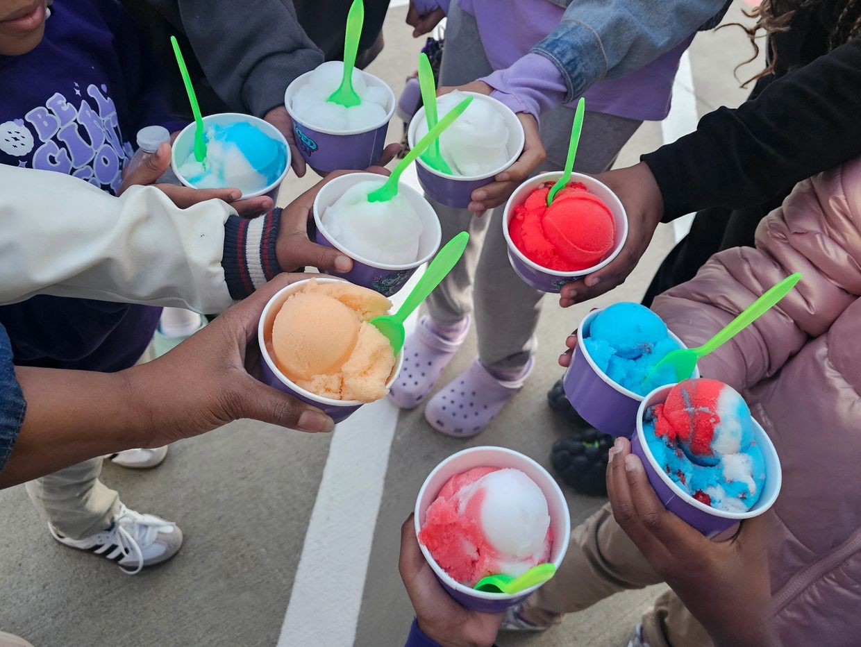 kids holding cups of Iced Out Philly water ice