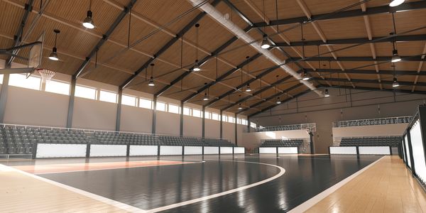 A basketball gym by ABS equipped with high-quality gym equipment by Performance Sports and bleachers