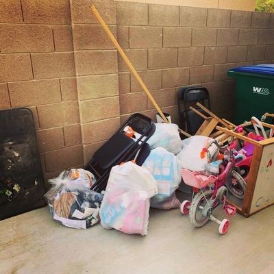 Pile of bulk trash removed from behind the gate in a side yard in Maricopa Az by Just Haul It LLC