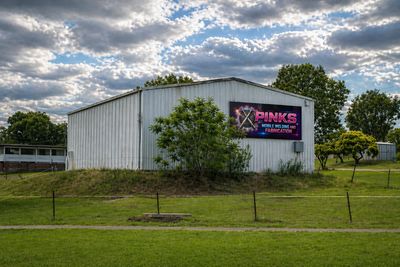 Pinks Mobile Welding and Fabrication workshop with exterior business signage.