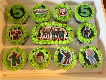 Roblox-themed birthday cupcakes with green icing and character toppers.