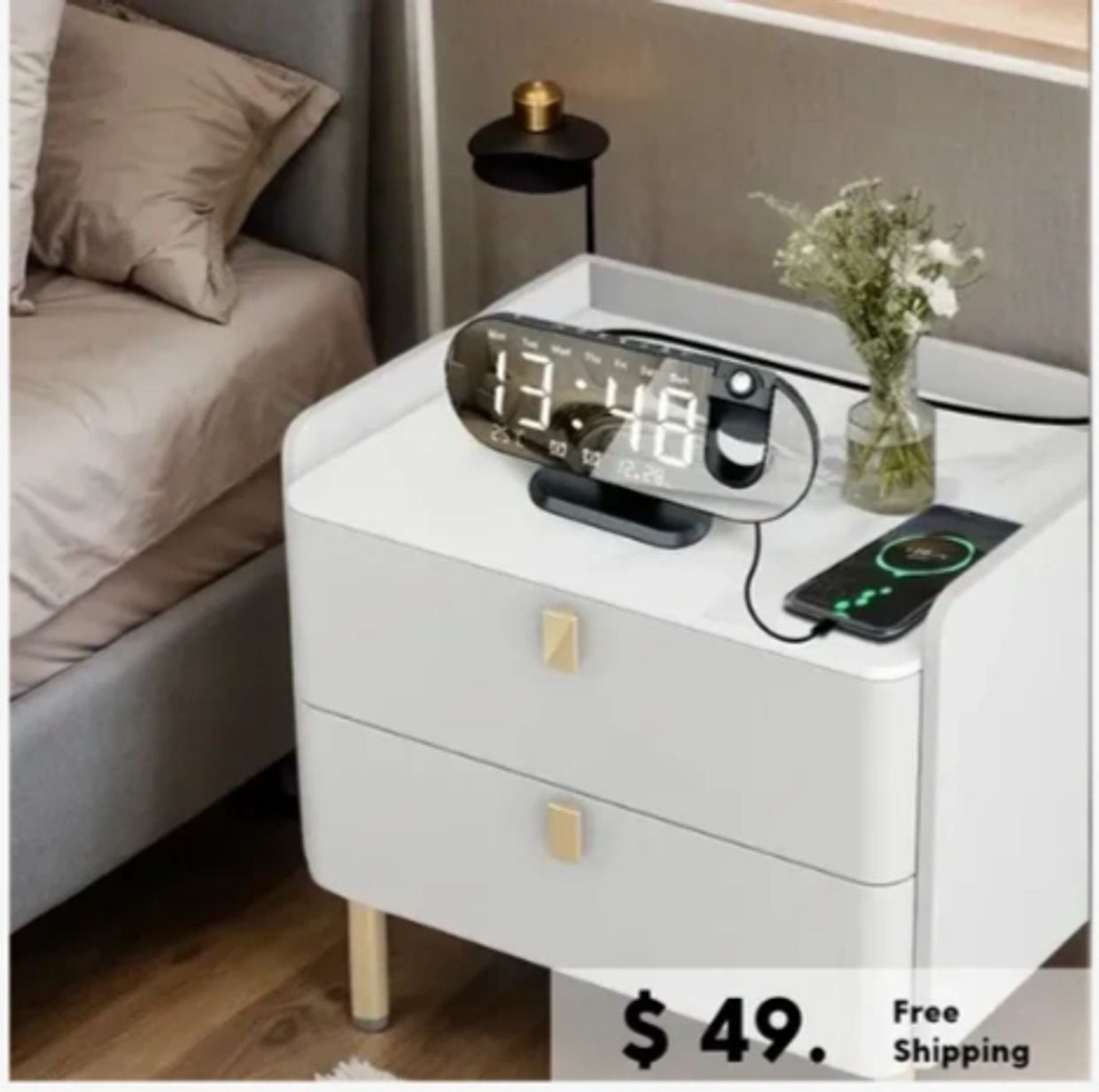 Modern bedside table with digital clock, phone charging, and flowers for $49 with free shipping.
