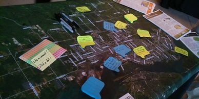 Photo of our booth at a public outreach event. Click to visit our Get Involved page.