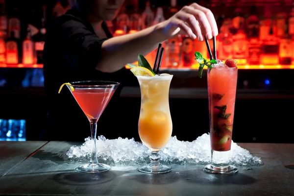 Setting up specialty drinks at the bar