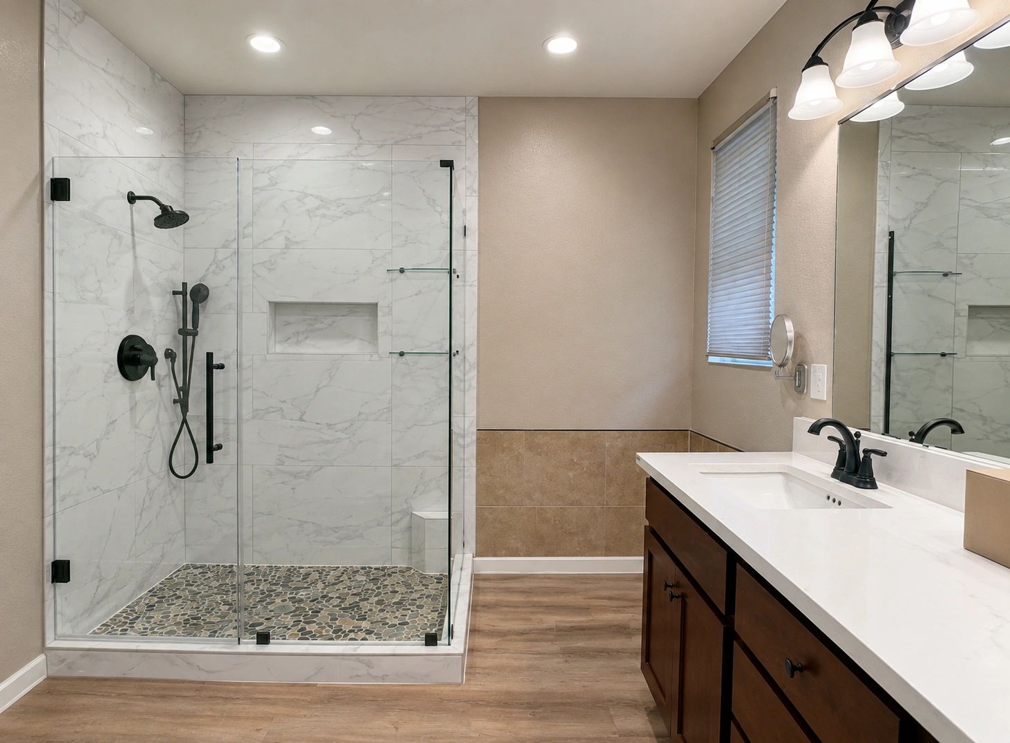 Modern bathroom remodel with walk-in tile shower, glass enclosure, pebble shower floor and vanity