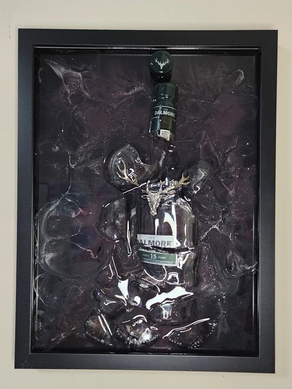 Melted Dalmore 15-year whisky bottle artwork in black frame.