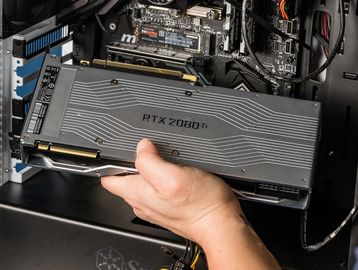 a person installing a gpu