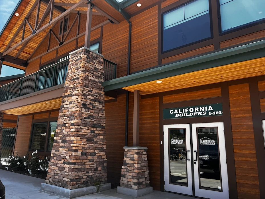 Wood and stone exterior of California Builders office building.