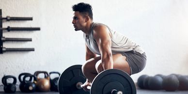 Strength & Conditioning gym training with barbell deadlift