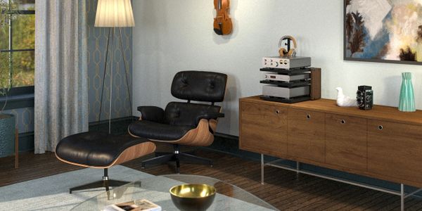 Modern living room with a black leather lounge chair and wooden sideboard.