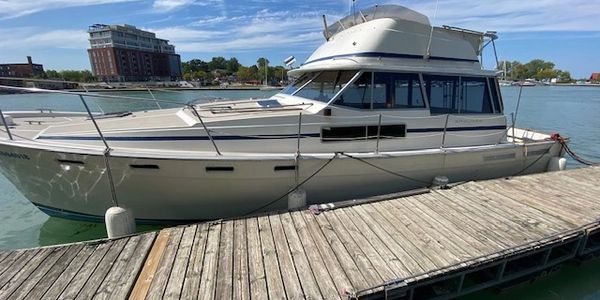 Bayliner 3870 at the dock, for sale by Breezeway Yachts
