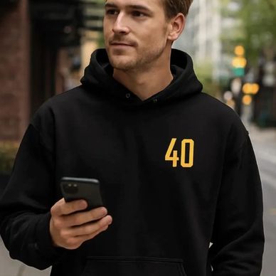 A guy wearing a Vancouver Canucks Flying Skate hoodie with 40 on the chest 