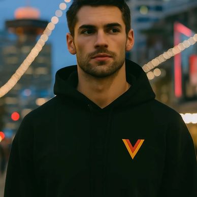A guy wearing a Vancouver Canucks Flying Skate hoodie with the Flying V on the chest 