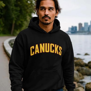 A guy wearing a Vancouver Canucks Flying Skate hoodie with Canucks on the front. Flying V on arm