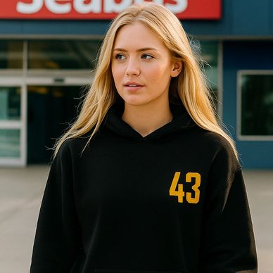 A girl wearing a Vancouver Canucks Flying Skate Quinn Hughes 43 hoodie