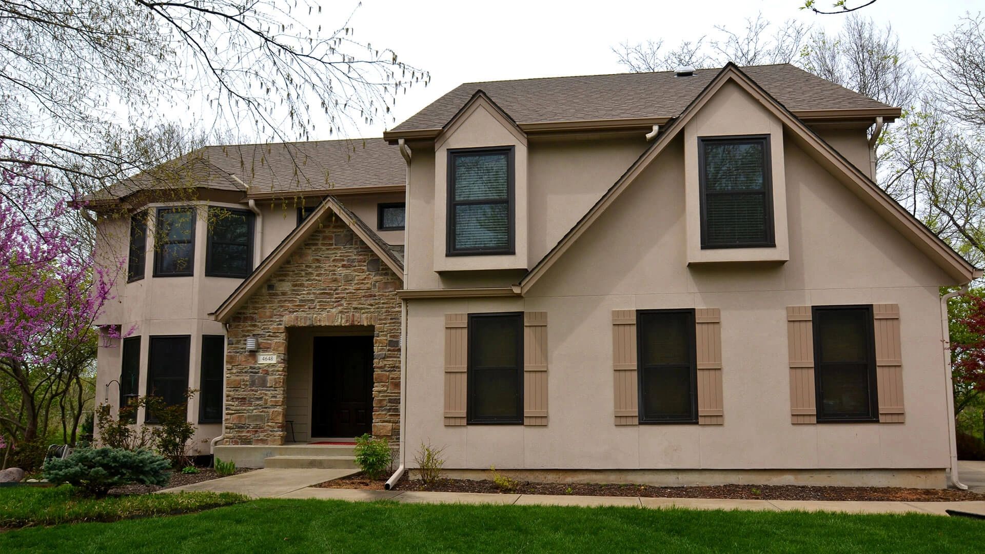 Stucco and stone veneer Home