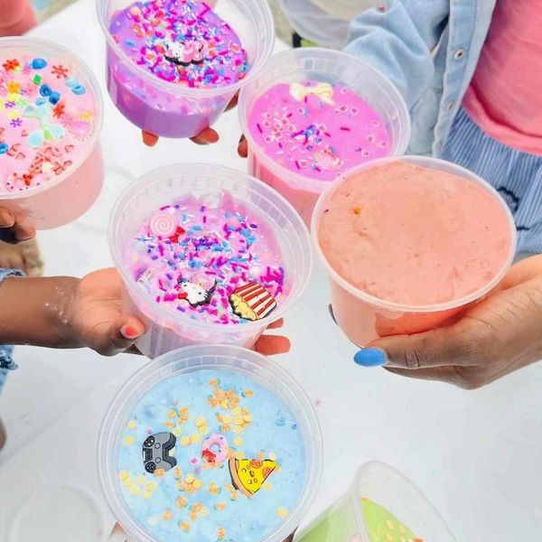 Colorful slime cups with sprinkles and charms.