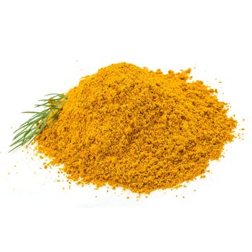 A heap of bright yellow turmeric powder with a small green herb sprig.