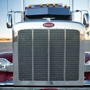 Front view of a silver Peterbilt semi-truck grille.