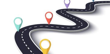 Curvy road with colorful map location pins marking points along the path.