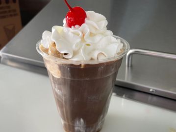 coffee poured over your favorite flavor of Leiby's ice cream topped with whipped cream and a cherry.