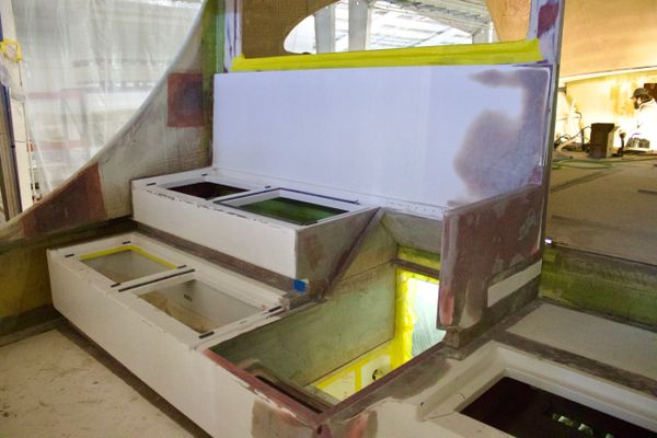 Unfinished cockpit or control panel structure under construction indoors.